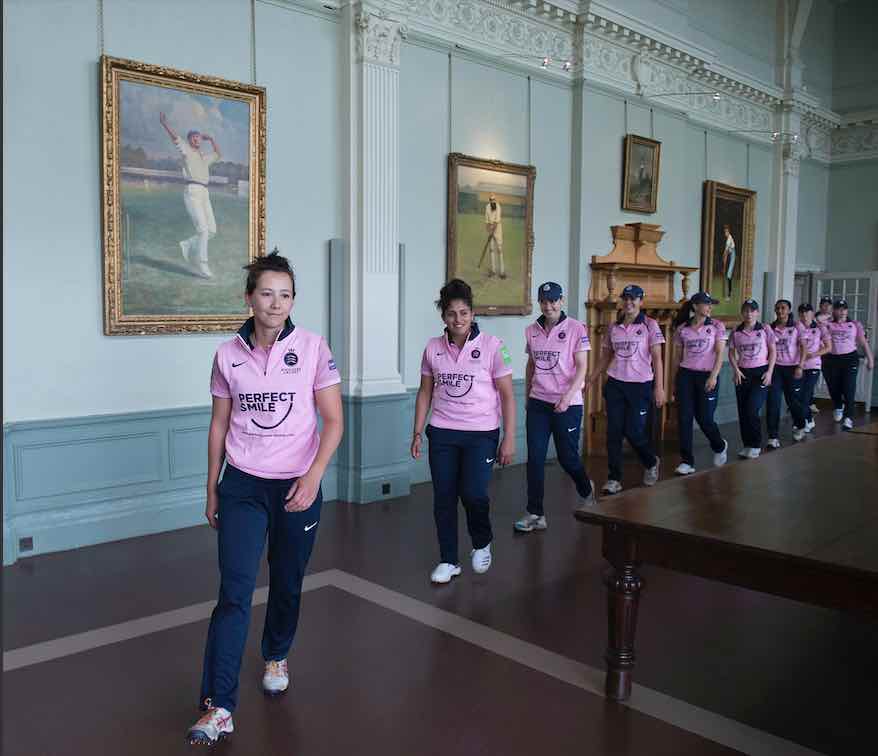 Natasha Miles leads her Middlesex team through the Long Room