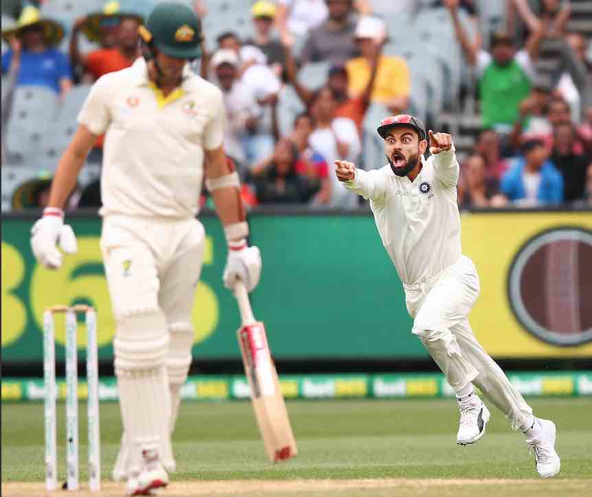 Virat Kohli enjoys the dismissal of Australia’s Pat Cummins