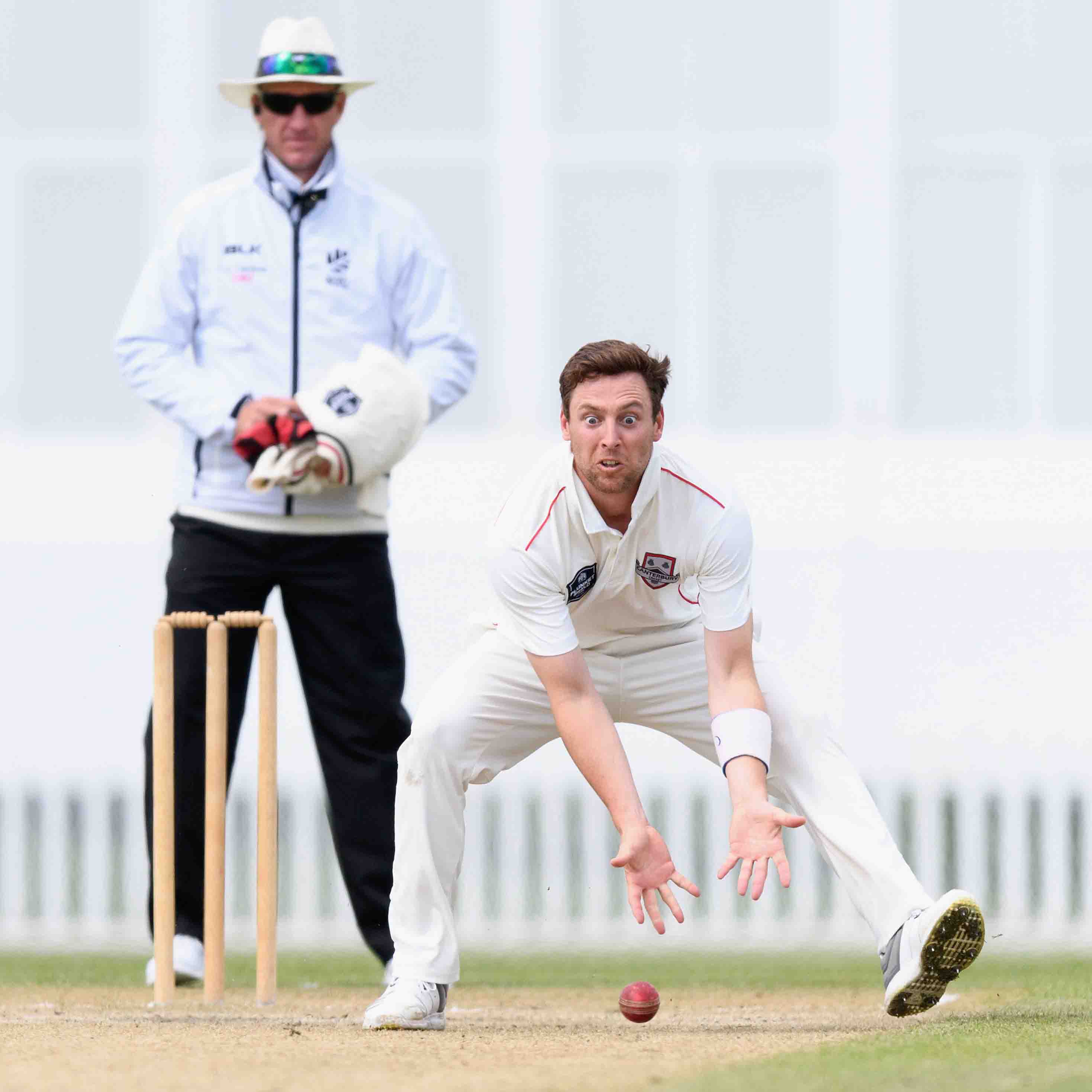 Matt Henry of Canterbury fields the ball off his own bowling during the Plunket Shield match between Canterbury and Northern Districts at Hagley Oval.
